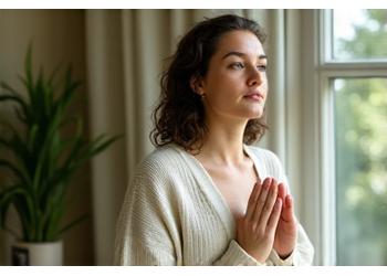 A behind-the-scenes shot of a wellness expert in a relaxed setting, possibly in their home office or doing a personal mindfulness practice, conveying authenticity.
