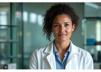 Dr. Rhonda Patrick intently discussing nutritional science, with a background of scientific diagrams.