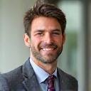 Confident man in his early 40s in professional attire, looking healthy and vibrant.